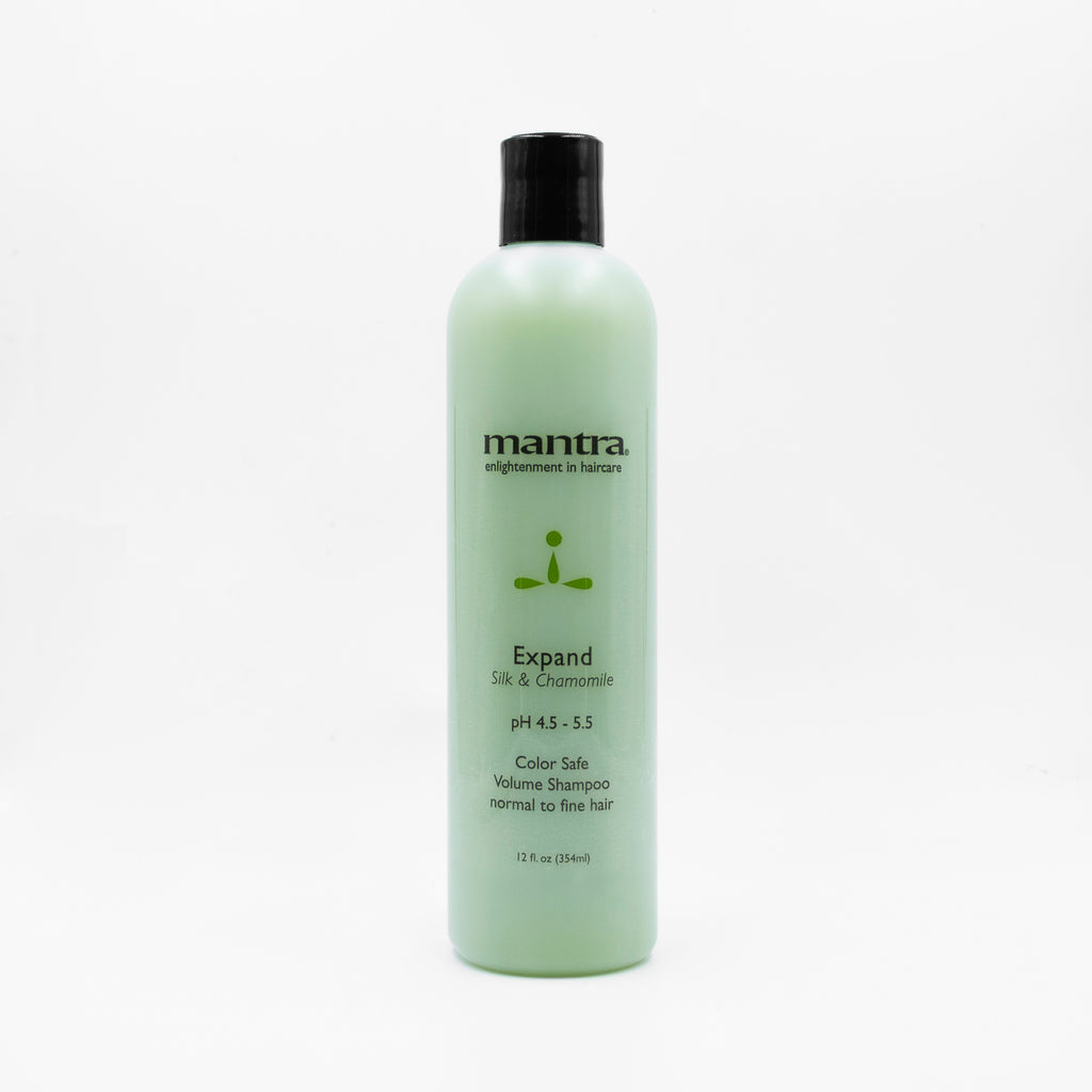Mantra Expand volume shampoo in a pale green 12 oz flip-cap bottle on white