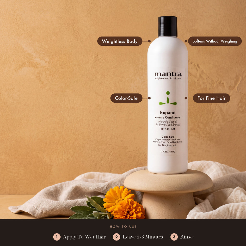 Mantra Expand Volume Conditioner on a sand pedestal with marigold and sage: weightless body, softens without weighing, color-safe, for fine hair. How to use: apply to wet hair, leave 2 to 3 minutes, rinse
