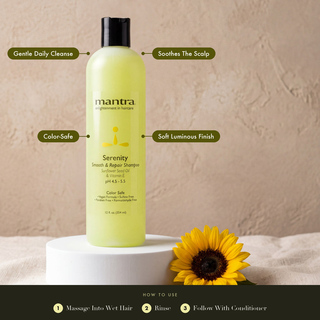 Mantra Serenity Daily Shampoo on a white cylinder with a sunflower: gentle daily cleanse, soothes the scalp, color-safe, soft luminous finish. How to use: massage into wet hair, rinse, follow with conditioner