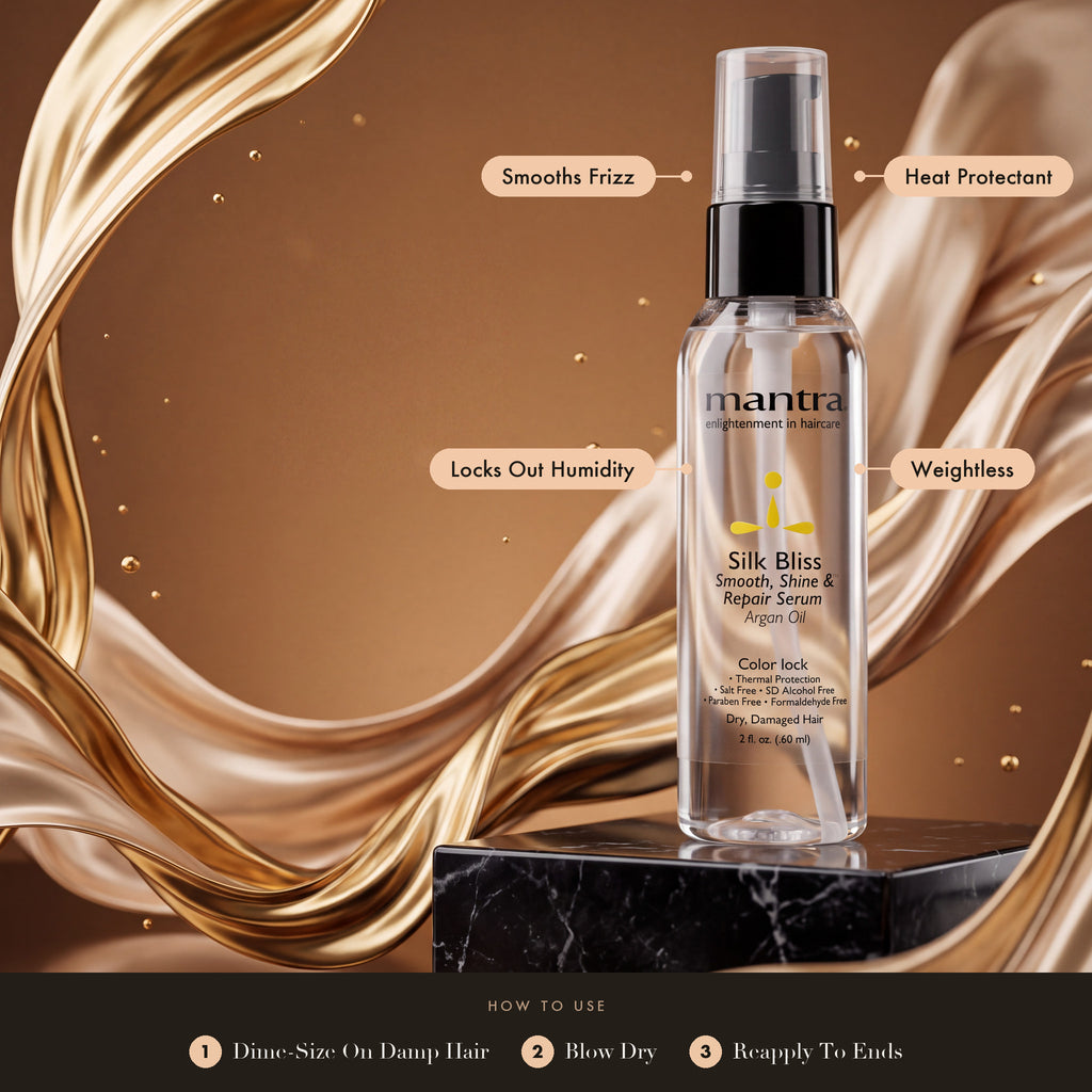 Mantra Silk Bliss Smoothing Serum on black marble with liquid gold silk: smooths frizz, heat protectant, locks out humidity, weightless. How to use: dime-size on damp hair, blow dry, reapply to ends